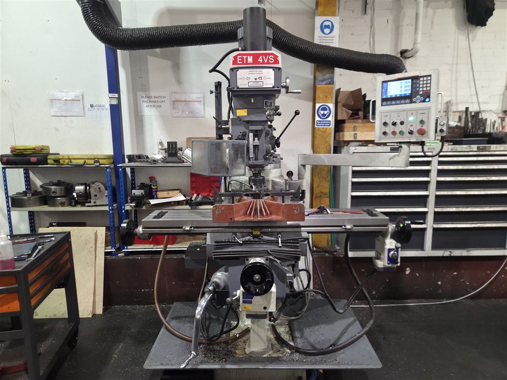 An ETM 4VS turret milling machine with a digital readout, set up in the workshop.